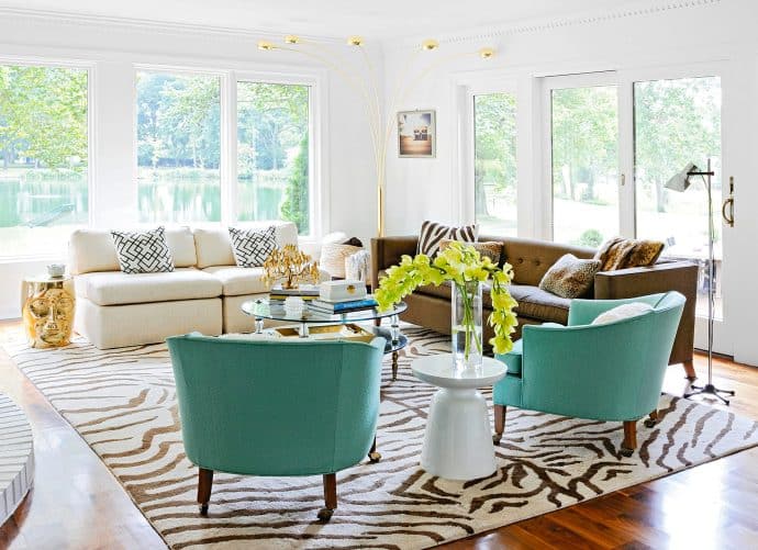 5 rules in Interior Design that we are begging you to break! white room with two blue armchairs and two sofas - 5 rules in Interior Design that we are begging you to break!