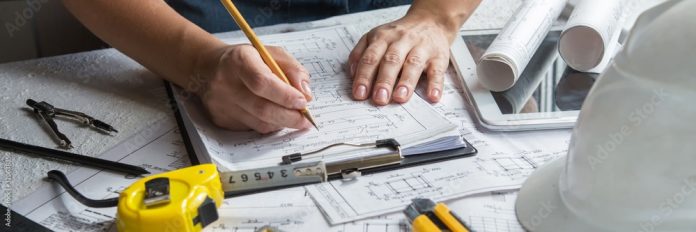 architects-concept-engineer-architect-designer-freelance-work-on-start-up-project-drawing-construction-plan-architect-design-working-drawing-sketch-plans-blueprints-and-making-construction-model-stockpack-adobe-stock