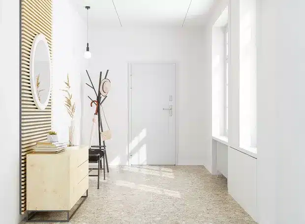 Dicas para decorar o hall de entrada com móveis elegantes e funcionais a white room with a white door