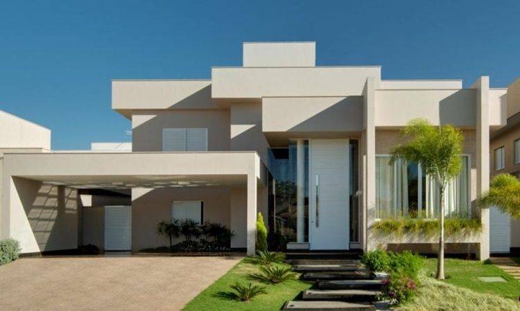 7 Vantagens de Ter uma Casa Caixote e 30 ideias para se inspirar! 2 Telhado embutido em casa moderna, com linhas retas e aparência clean.