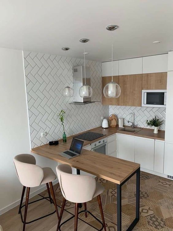 12 Ideias para Cozinha com Copa Integrada que Você Vai Amar 5 Espaço adaptado para tarefas como trabalhos rápidos e estudo.