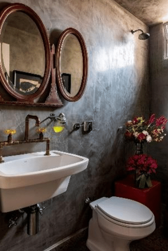 Banheiro Rústico: Dicas e Modelos para se Inspirar. 6 Neste banheiro rústico, a tinta é ecológica e feita a base de água e terra e o piso é de concreto e resíduos de vidro – Projeto: Messa Penna Arquitetura | Foto: Renato Navarro/CASACOR