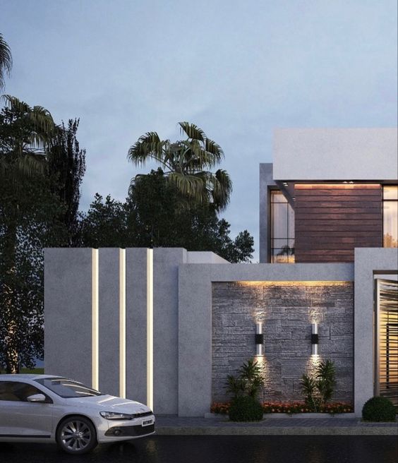 15 Modelos de Muros Modernos para Inspirar sua Casa 11 Em casas mais altas, considere ainda que a fachada irá aparecer mesmo com o muro. Tendo em vista esse fator, poderá analisar como gerar harmonia e ao mesmo tempo contraste entre as partes.
