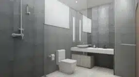 Banheiro cinza com design que ressalta a versatilidade da cor na decoração.
