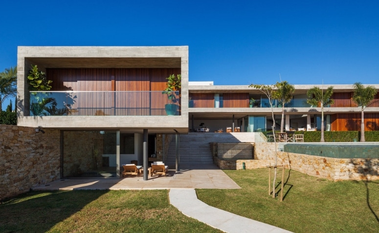 Casa em L: 60 modelos e plantas para inspirar o seu projeto 3 Casa em L com design elegante e contemporâneo.