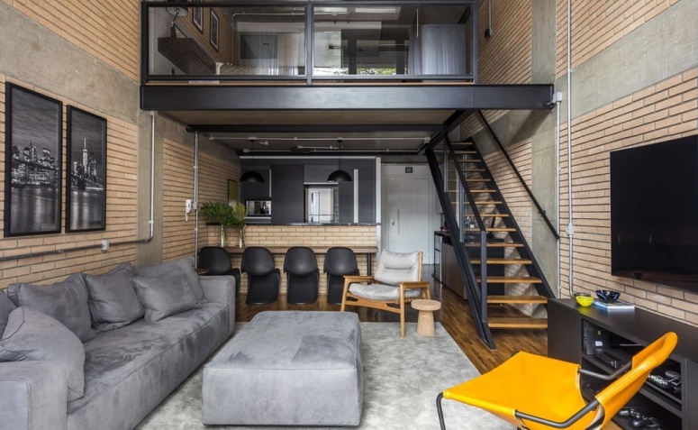 10 Ideias de Decoração de Sala para Transformar o Ambiente 1 Sala de estilo industrial, com elementos em madeira e ferro, características de lofts.