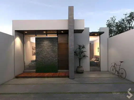 9 Inspirações de Fachadas de Casa para Todos os Estilos 10 Fachada com revestimento de porcelanato em combinação com madeira e tijolos de pedras.